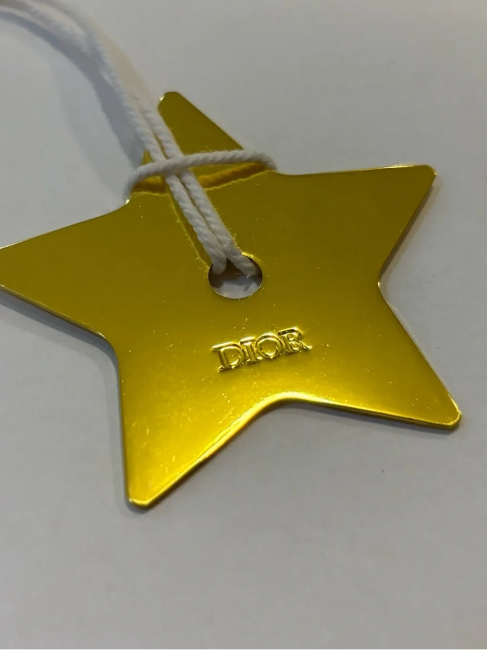 Dior Metallic Gold Star Tag with White Cord